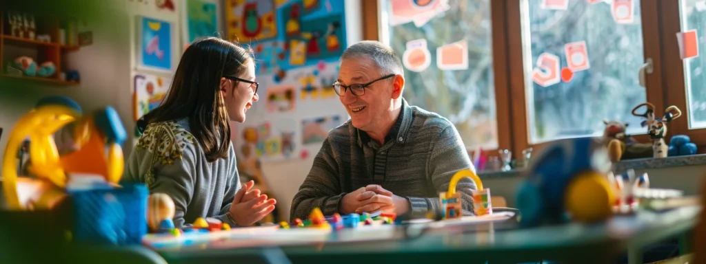 a parent and a daycare provider engaged in a friendly conversation during a parent meeting, surrounded by colorful drawings and toys.